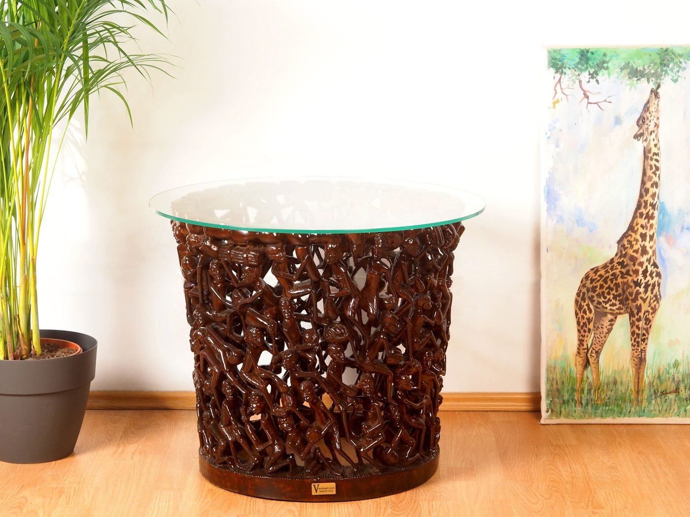 Makonde Carved Coffee Table with Glass Top — hand-carved mongongo wood, Mwenge, Dar es Salaam, Tanzania