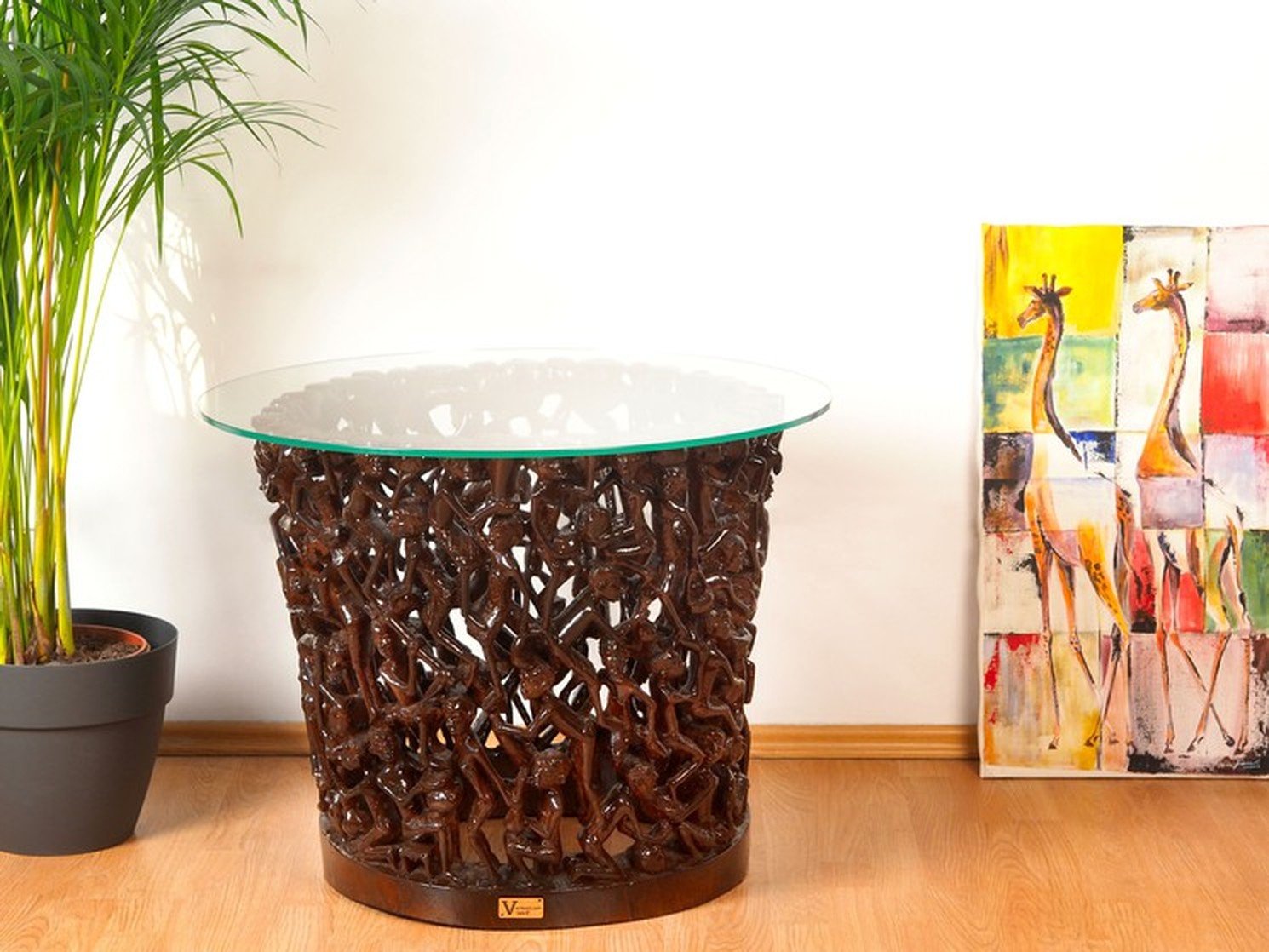 Makonde Glass-Top Table — hand-carved mongongo wood, one of one, carved at Mwenge, Dar es Salaam, Tanzania