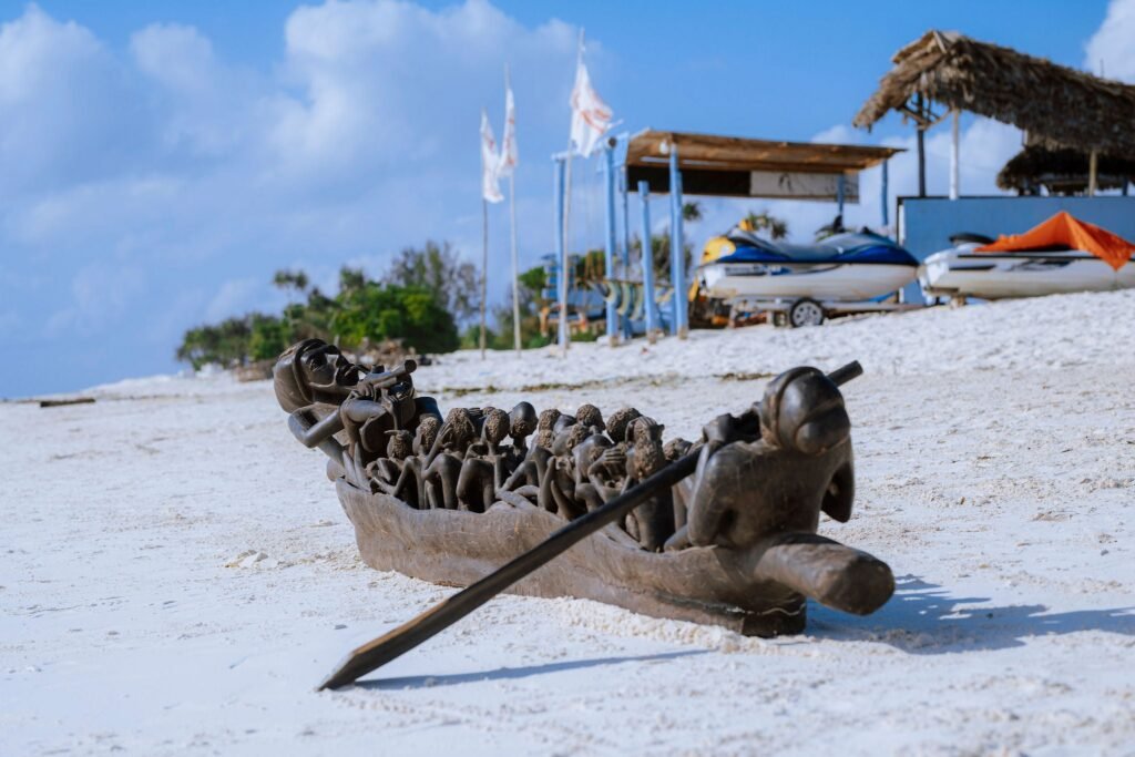 Group photograph of carved furniture and thrones on the beach — 0S7A4999.