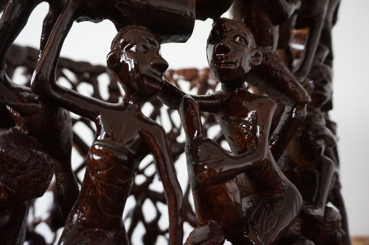 Makonde Carved Coffee Table with Glass Top – Luxury Hand-Carved Tribal Art for Dubai Interiors