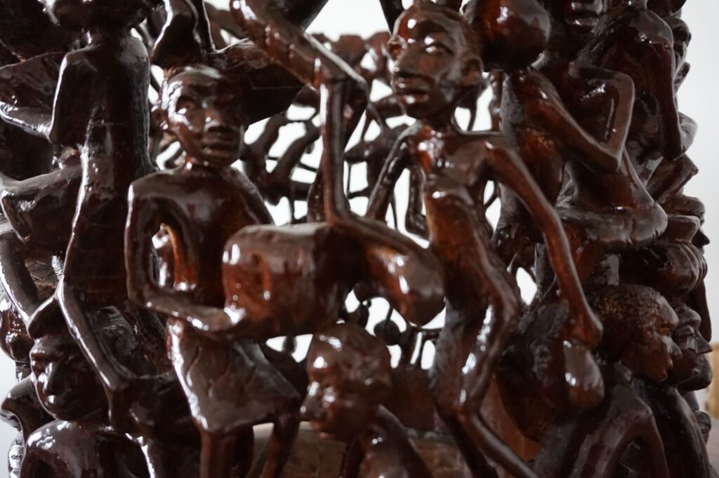 Makonde Carved Coffee Table with Glass Top – Luxury Hand-Carved Tribal Art for Dubai Interiors