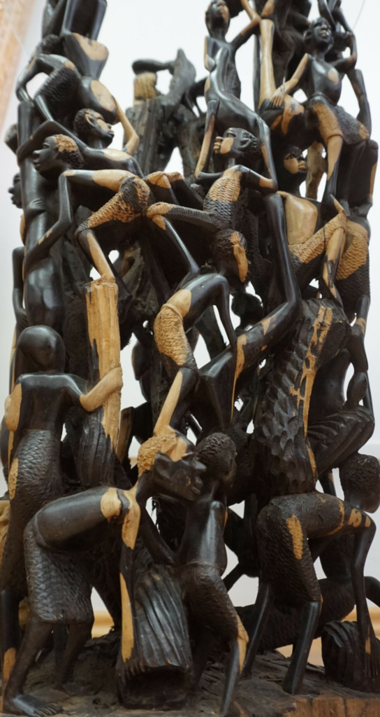 Makonde Ebony Side Table – Luxury Hand-Carved Art with Glass Top for Dubai Interiors