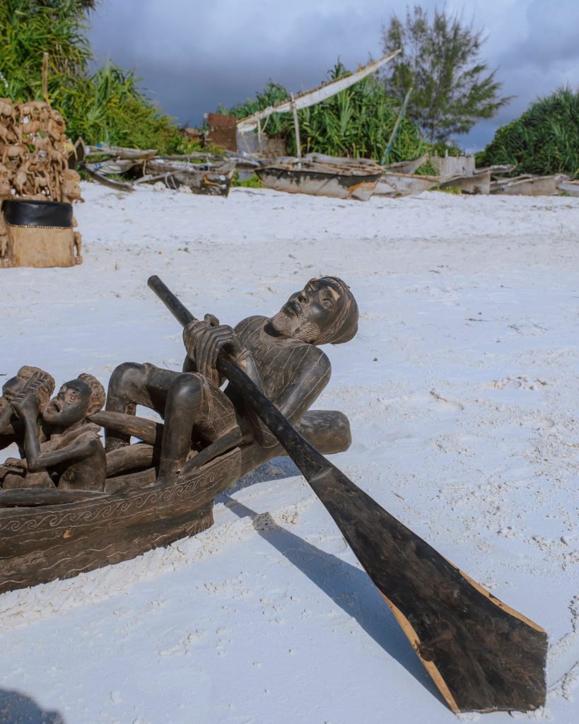 Group photograph of carved furniture and thrones on the beach — 0S7A5008.